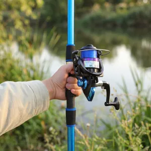 Spinning fishing rod and reel set with ML-3000 reel, outdoor fishing gear equipment for travel.