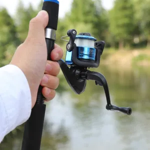 Detail view of fishing rod and spinning reel set, durable carbon fiber handle, smooth gear.