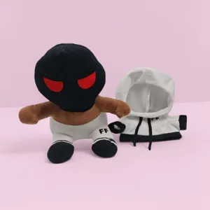 Close-up detail shot of the plush doll with black mask and white hoodie featuring FF logo.