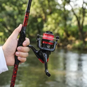 Telescopic fishing rod and spinning reel set detail, portable travel gear for outdoor fishing.