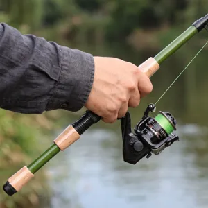 Close-up detail of the telescopic fishing rod with spinning reel and comfortable grip.