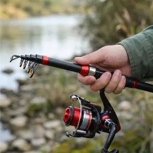Caña de pescar telescópica portátil y carrete de spinning en negro y rojo para pesca al aire libre.