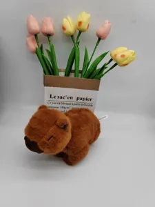Brown capybara plush toy detail, soft fluffy stuffed animal doll, cute design cartoon toy.