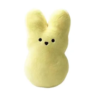 Close-up detail of the yellow plush bunny toy, soft texture and cute shape design.