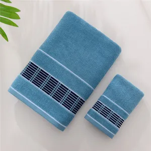 Cotton bath towel set in blue with striped geometric borders for daily home use.