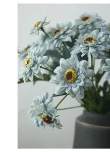 Artificial sunflower detail shot, vintage grey blue decorative flower arrangement for home decor