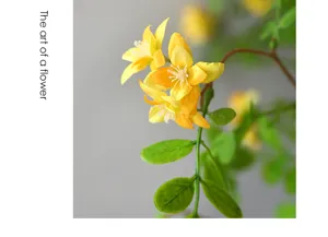 Close up detail of artificial yellow flower stem for home decor and floral arrangement