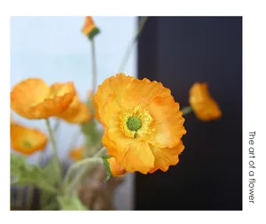 Artificial poppy silk flower bouquet for home wedding decoration in bright orange.