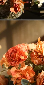 Detailaufnahme künstlicher Blumen, Nahaufnahme eines orangen Rosenstraußes, natürliche Deko.