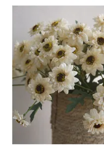 Artificial white sunflower bouquet in woven vase, vintage floral home decor centerpiece.