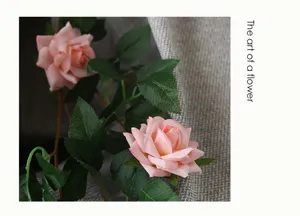 Artificial rose vine detail shot, pink floral garland for home wall decor and engineering deco.