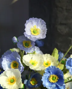 Artificial blue and white poppy flower bouquet detail for home decoration and wedding events.