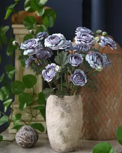 Artificial ranunculus silk flower detail view, elegant purple peony bouquet for home decor.