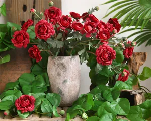 Artificial ranunculus flower bouquet detail view, elegant silk floral decor for table.