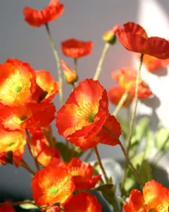 Artificial poppy flower bouquet for home wedding decoration, realistic red flocking simulation.