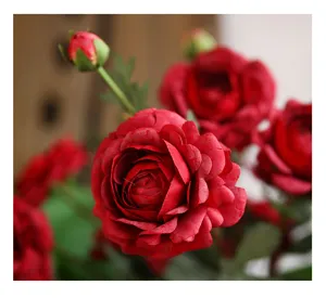 Detailed shot of red artificial ranunculus silk flower, perfect for home decor and floral art.