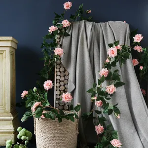 Artificial rose vine for home wall decor, pink flower garland for wedding party decoration.