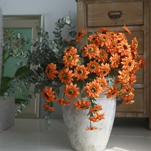 Vintage artificial sunflower and eucalyptus flower arrangement for home decor, main view.