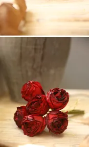Vintage burnt edge artificial red rose flower bouquet close-up view for home decor