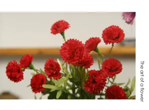 Artificial red carnation flower bouquet for home decoration and dining table centerpieces.