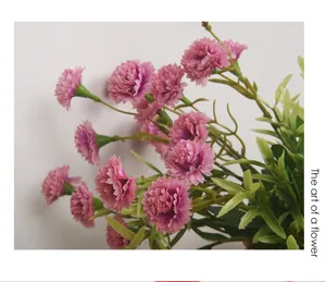 Artificial pink carnations flower bouquet detail shot, perfect for home decor table centerpiece.