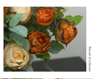 Close-up of artificial burnt-edge roses with green leaves, elegant floral home decor detail.