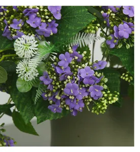 Detail shot of artificial hydrangea snowball flower arrangement, perfect for home and hotel decor.