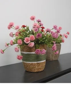 Artificial carnation flowers in woven basket pot, perfect table centerpiece for home living room decor.