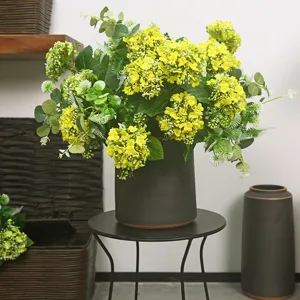 Seven heads artificial snowball flower bouquet with grey ceramic vase for home decor.