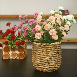 Artificial carnation flowers bouquet in woven basket for home decor table centerpiece wedding decoration.