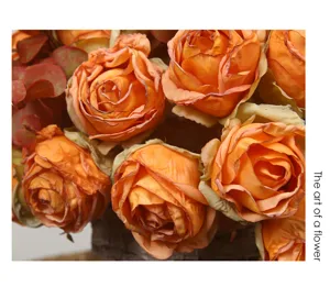 Close-up detail of artificial burnt edge rose bouquet, vintage floral arrangement for home decor