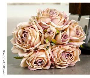 Close up of vintage artificial rose bouquet detail, romantic curled petals decor for room.