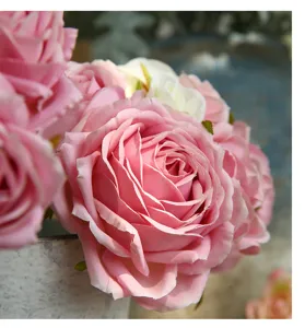 Close-up detail of artificial pink retro curled roses bouquet, perfect for elegant home decor.