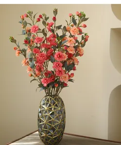 Artificial camellia flower bouquet detail, elegant home table decor and window floral arrangement.