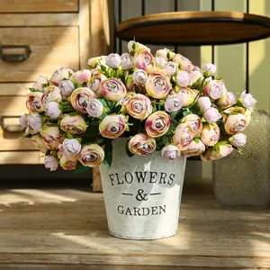 Artificial camellia flower arrangement in vintage metal pot for home decor centerpiece.