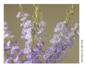 Artificial purple delphinium flower detail, lifelike floral decor for home living room.