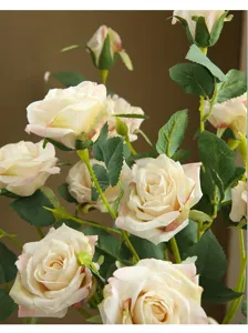 Artificial rose flower bouquet with gradient pink edges, detailed petals and green leaves for home.