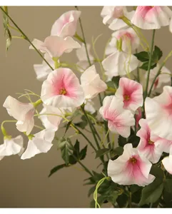 Artificial morning glory detail shot, soft pink and white gradient petals with green leaves for home decor.