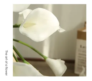 Artificial calla lily flower detail close up, white floral decor photography prop.