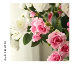 Artificial rose flower bouquet detail, pink and white fake roses for home decor and tabletop display.