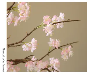 Artificial pink flower branch detail, elegant faux floral stem for modern home decor display.
