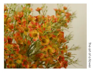 Artificial plum blossom branch, vibrant orange floral decor for home and photography.