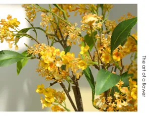 Artificial yellow flower branch close-up, faux floral decor for modern home living room.