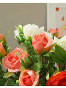 Close up view of artificial silk roses bouquet with green leaves for home decoration detail