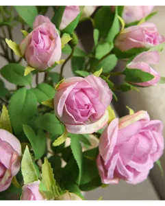 Artificial pink rose silk flowers detail shot, perfect for home decor and floral arrangements.