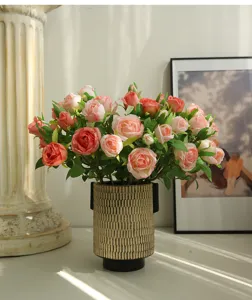 Close-up of French romantic artificial rose bouquet with textured vase for home decor.