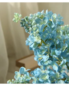 Detailed close-up view of artificial moisturizing blue lilac flower, perfect for home decor.