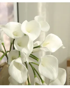 Close-up detail of artificial white calla lily flower head, soft touch texture for decor.
