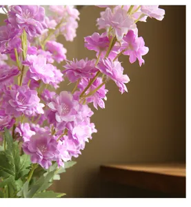 Close-up detail shot of artificial purple delphinium flower branches for home decor.