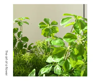 Artificial green plant detail, realistic faux foliage leaves for indoor outdoor decor.